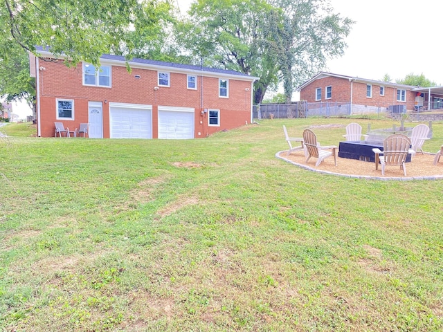 2801 Denham Ave, Columbia, TN 38401 - view of yard with an attached garage and an outdoor fire pit