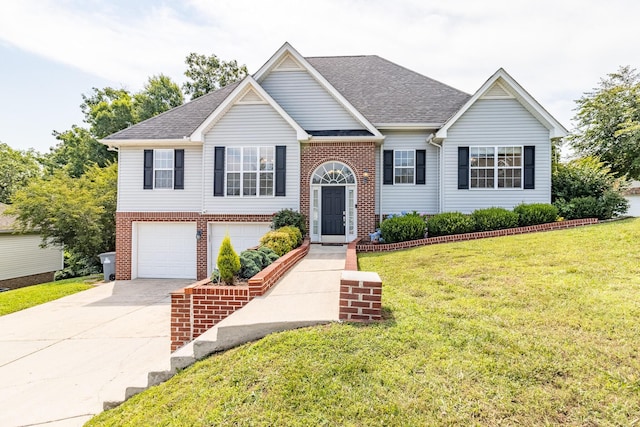 7322 British Rd, Ooltewah, TN 37363 - raised ranch featuring brick siding, driveway, a front lawn, and roof with shingles
