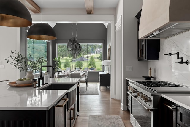 4896 Bethesda Rd, Thompsons Station, TN 37179 - kitchen featuring high end stainless steel range, custom range hood, beamed ceiling, dark cabinetry, and wood finished floors