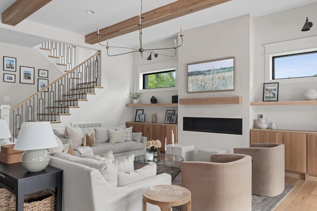 4896 Bethesda Rd, Thompsons Station, TN 37179 - living room featuring beamed ceiling, wood finished floors, plenty of natural light, stairway, and a chandelier