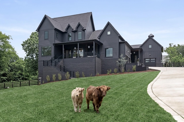 4896 Bethesda Rd, Thompsons Station, TN 37179 - view of front facade featuring driveway, stairs, a garage, and covered porch