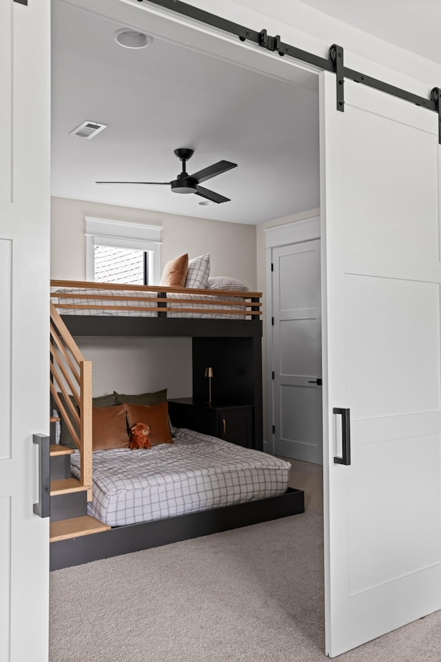 4896 Bethesda Rd, Thompsons Station, TN 37179 - bedroom featuring carpet floors, a barn door, and ceiling fan