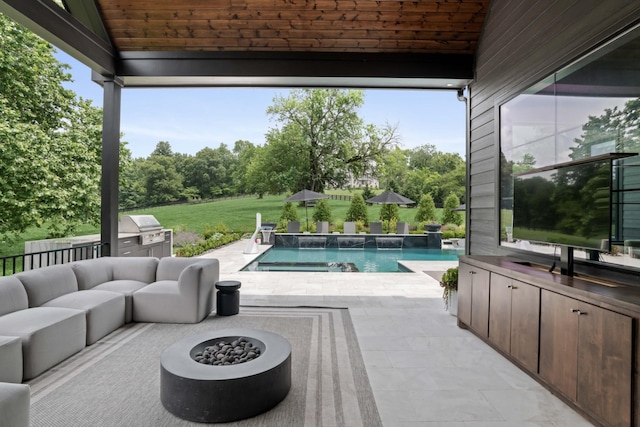 4896 Bethesda Rd, Thompsons Station, TN 37179 - view of patio / terrace featuring an outdoor kitchen, an outdoor pool, an outdoor living space with a fire pit, and view of scattered trees