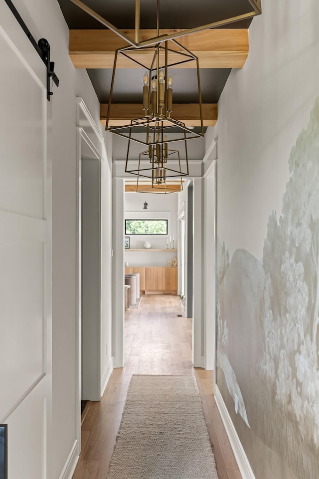 4896 Bethesda Rd, Thompsons Station, TN 37179 - hall featuring a chandelier, wood finished floors, and a barn door
