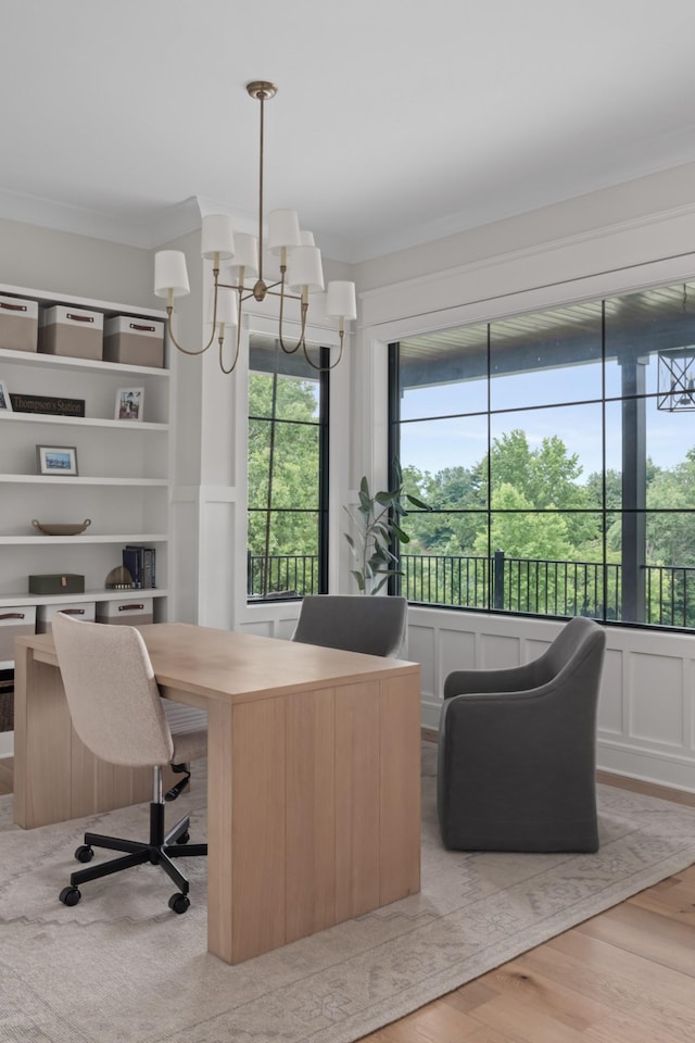 4896 Bethesda Rd, Thompsons Station, TN 37179 - office area with a chandelier, crown molding, light wood-style floors, and a decorative wall