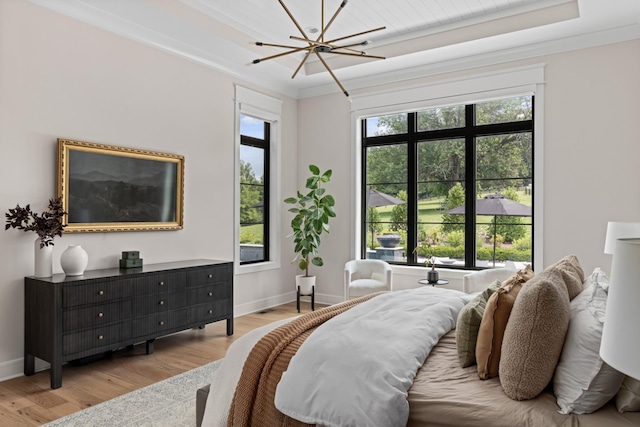 4896 Bethesda Rd, Thompsons Station, TN 37179 - bedroom featuring light wood finished floors, a raised ceiling, a chandelier, and ornamental molding
