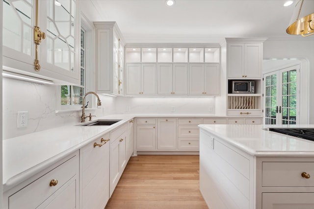 2455 Hidden River Ln, Franklin, TN 37069 - kitchen with appliances with stainless steel finishes, white cabinets, light countertops, light wood-style flooring, and recessed lighting
