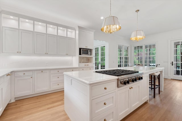 2455 Hidden River Ln, Franklin, TN 37069 - kitchen featuring stainless steel appliances, a chandelier, light wood-style floors, white cabinetry, and recessed lighting