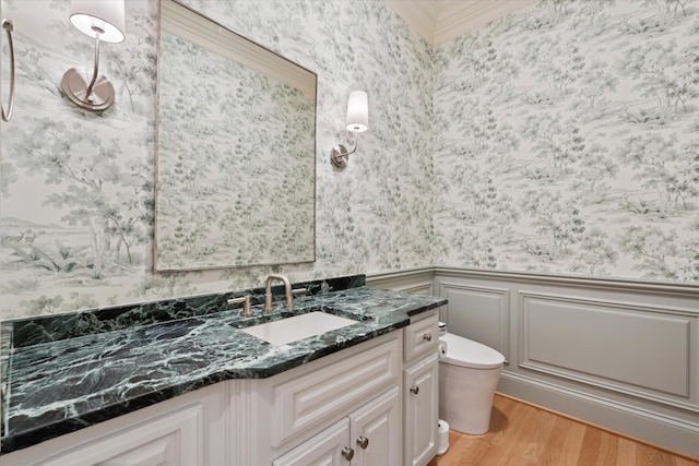 2455 Hidden River Ln, Franklin, TN 37069 - bathroom with wallpapered walls, vanity, wood finished floors, and wainscoting