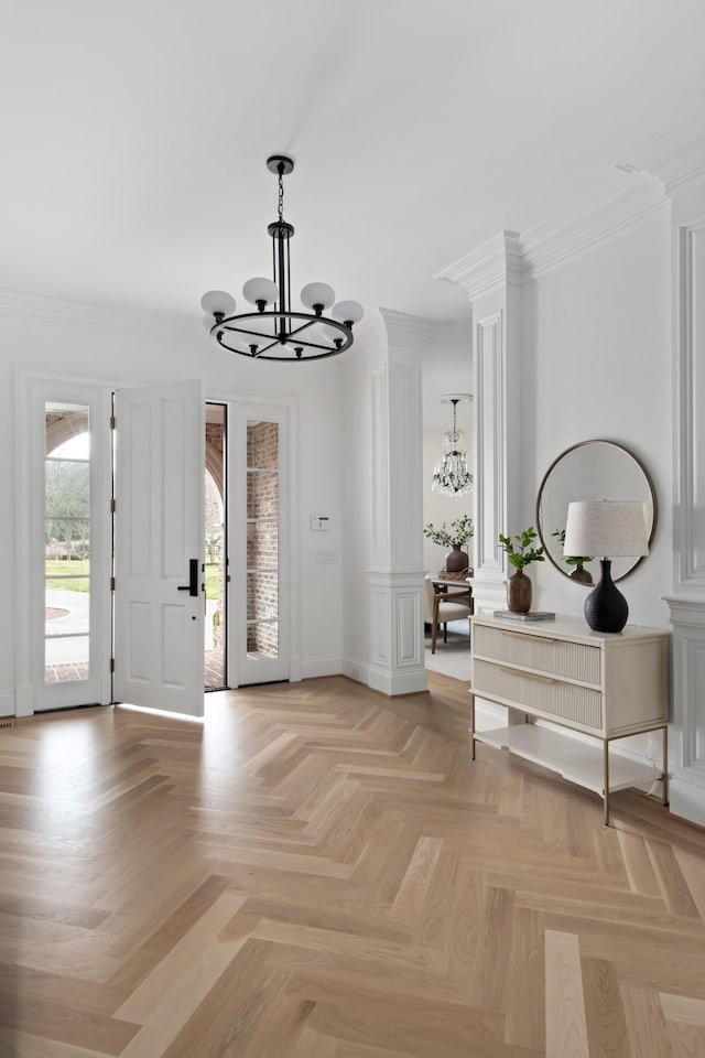 2455 Hidden River Ln, Franklin, TN 37069 - foyer with a chandelier, ornate columns, and crown molding