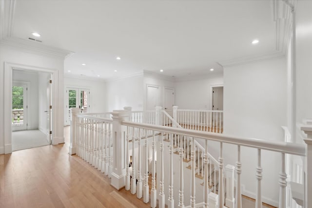 2455 Hidden River Ln, Franklin, TN 37069 - hallway with an upstairs landing, wood finished floors, recessed lighting, french doors, and crown molding