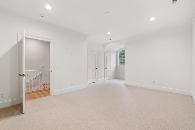 2455 Hidden River Ln, Franklin, TN 37069 - spare room featuring carpet flooring, recessed lighting, ornamental molding, arched walkways, and a smoke detector
