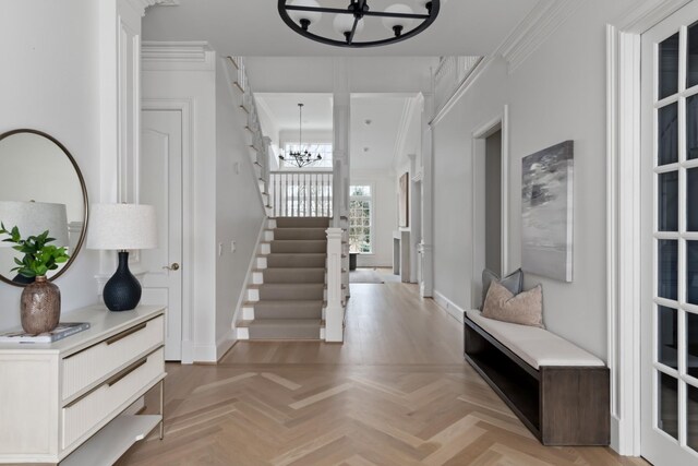 2455 Hidden River Ln, Franklin, TN 37069 - foyer featuring a chandelier, stairs, and ornamental molding