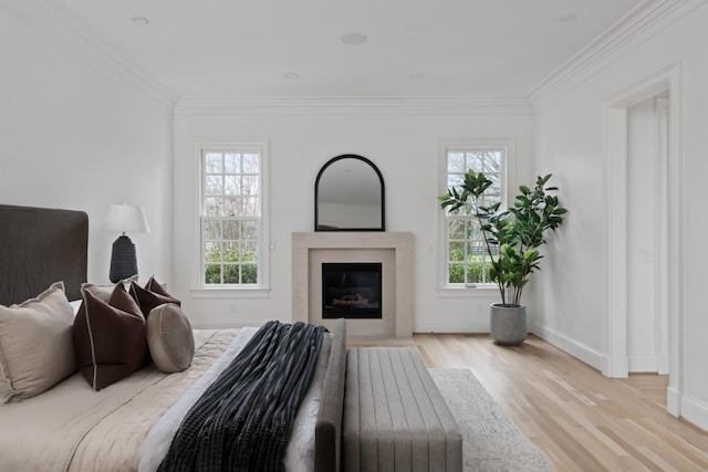 2455 Hidden River Ln, Franklin, TN 37069 - bedroom with crown molding, light wood-type flooring, and a glass covered fireplace