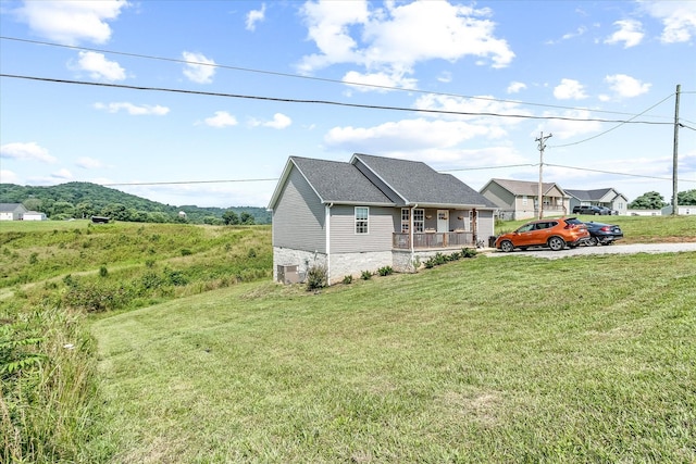 2190 Sullivan Knowles Rd, Sparta, TN 38583 - view of property exterior with covered porch and a yard