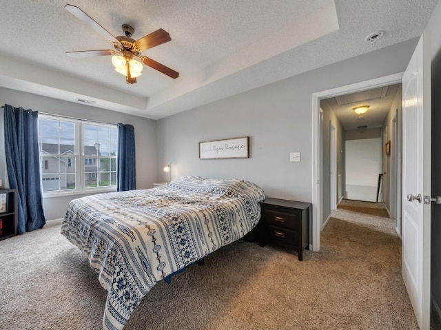 3786 Man O War Blvd, Clarksville, TN 37042 - carpeted bedroom with attic access, a textured ceiling, a tray ceiling, and a ceiling fan