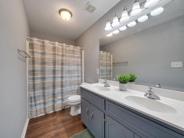 3786 Man O War Blvd, Clarksville, TN 37042 - full bath featuring double vanity, wood finished floors, a textured ceiling, and a shower with curtain