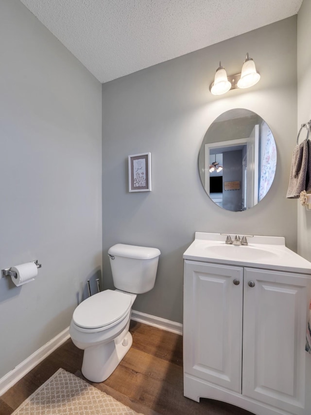 3786 Man O War Blvd, Clarksville, TN 37042 - bathroom with wood finished floors, vanity, and a textured ceiling