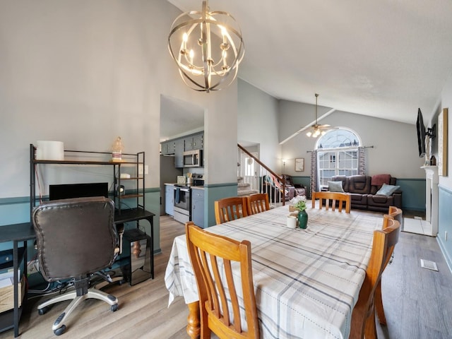 3786 Man O War Blvd, Clarksville, TN 37042 - dining room featuring light wood-style floors, a chandelier, stairway, ceiling fan, and high vaulted ceiling