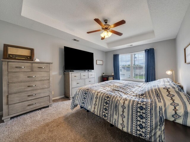 3786 Man O War Blvd, Clarksville, TN 37042 - bedroom with a tray ceiling, light carpet, a ceiling fan, and a textured ceiling