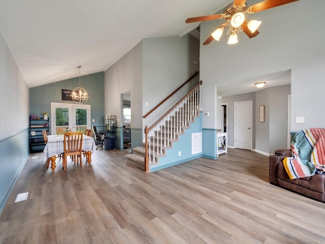 3786 Man O War Blvd, Clarksville, TN 37042 - dining area featuring high vaulted ceiling, a chandelier, stairway, wood finished floors, and a ceiling fan