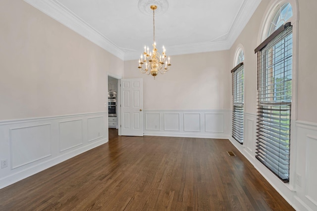 375 Natchez Trace Ct, Murfreesboro, TN 37127 - unfurnished dining area featuring a chandelier, a decorative wall, dark wood-style flooring, crown molding, and wainscoting