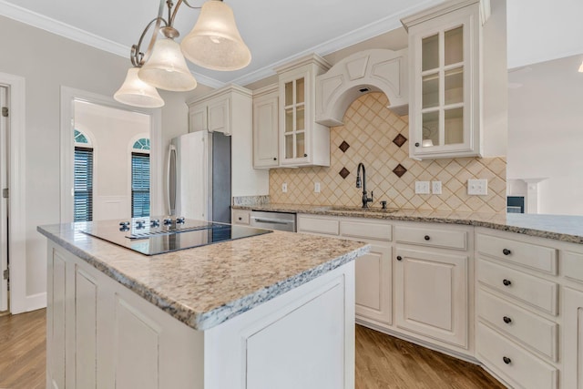 375 Natchez Trace Ct, Murfreesboro, TN 37127 - kitchen with appliances with stainless steel finishes, a kitchen island, wood finished floors, crown molding, and light stone counters