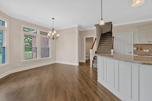 375 Natchez Trace Ct, Murfreesboro, TN 37127 - unfurnished dining area featuring stairs, dark wood-style floors, a chandelier, and crown molding