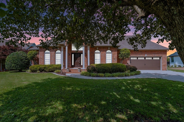 375 Natchez Trace Ct, Murfreesboro, TN 37127 - view of front of property featuring brick siding, driveway, a lawn, and a garage