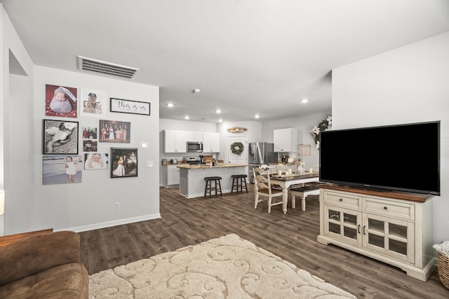 2028 Tate Farm Ln, White House, TN 37188 - living room featuring dark wood-style flooring and recessed lighting