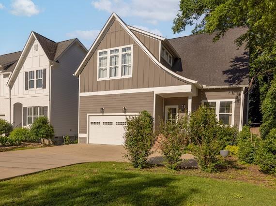 2207 Pennington Bend Rd Unit 3, Nashville, TN 37214 - craftsman-style home featuring board and batten siding, a garage, driveway, and a front yard