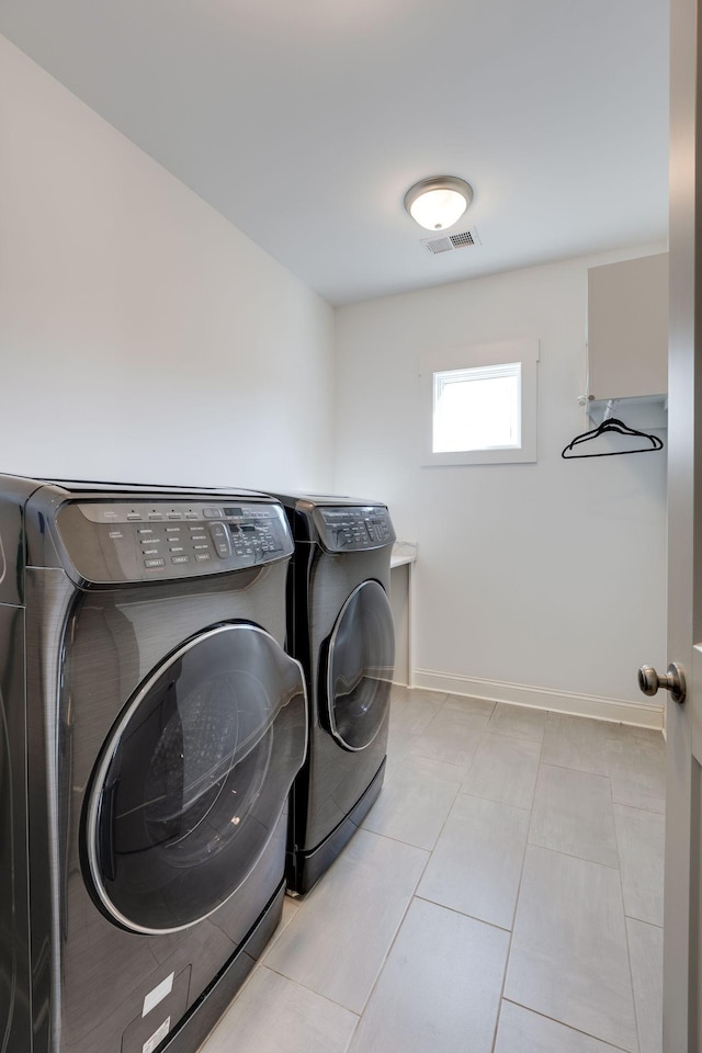 2207 Pennington Bend Rd Unit 3, Nashville, TN 37214 - laundry area featuring washing machine and dryer and light tile patterned floors