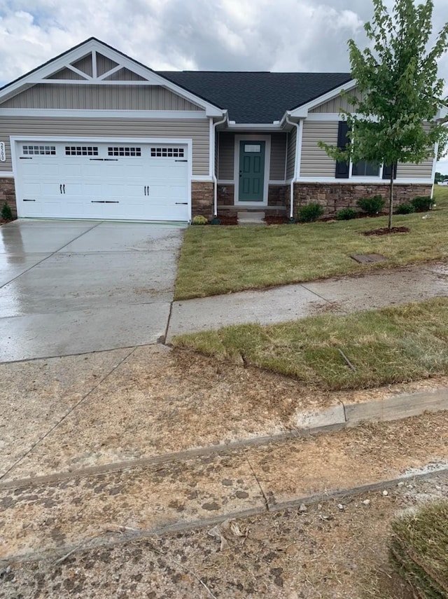 2500 Haskell Dr, Antioch, TN 37013 - craftsman-style home with stone siding, an attached garage, concrete driveway, and a front yard