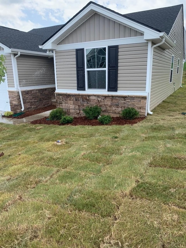 2500 Haskell Dr, Antioch, TN 37013 - view of side of property with a shingled roof, a lawn, and board and batten siding