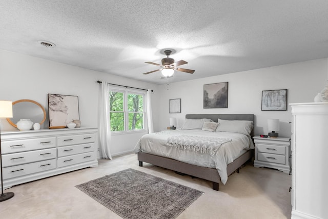 1830 Bradbury Rd, Adams, TN 37010 - bedroom with light colored carpet, a textured ceiling, and a ceiling fan