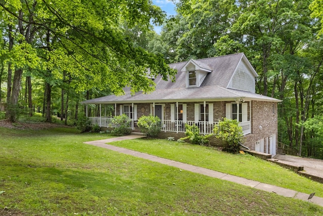 1830 Bradbury Rd, Adams, TN 37010 - view of front of property with an attached garage, a porch, a front lawn, and concrete driveway