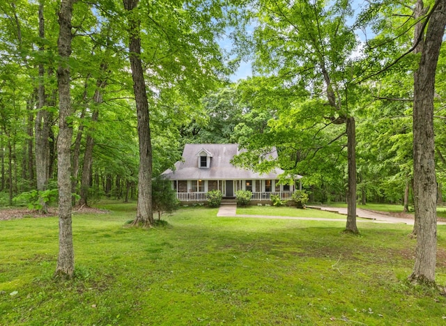 1830 Bradbury Rd, Adams, TN 37010 - new england style home with a porch and a front lawn