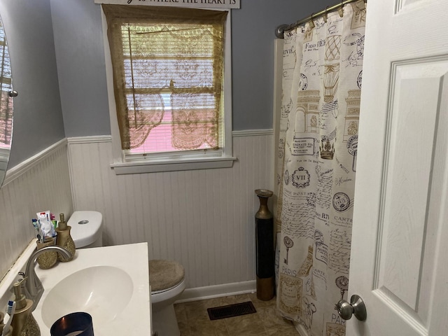 3701 Juandale Trl, Chattanooga, TN 37406 - bathroom with wainscoting, healthy amount of natural light, a shower with shower curtain, tile patterned flooring, and vanity