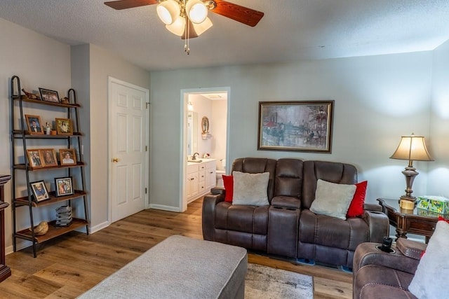 1699 Burnt Oak Dr Unit 195, Dalton, GA 30721 - living room featuring ceiling fan, wood finished floors, and a textured ceiling