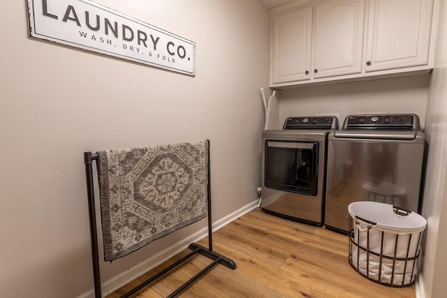 1699 Burnt Oak Dr Unit 195, Dalton, GA 30721 - laundry area featuring washer and clothes dryer, cabinet space, and light wood-style flooring