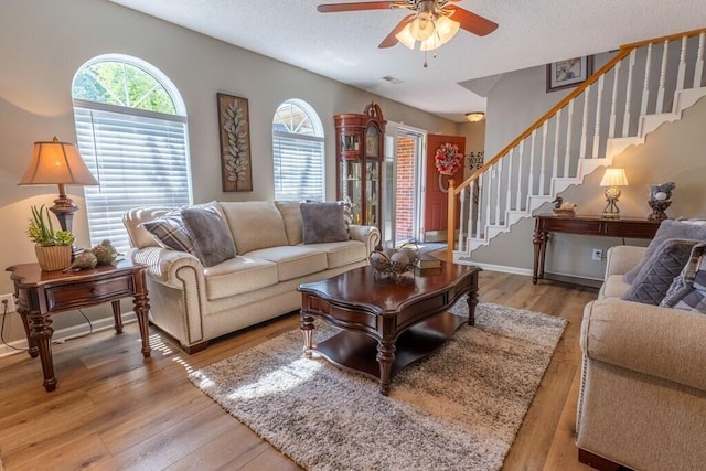 1699 Burnt Oak Dr Unit 195, Dalton, GA 30721 - living area featuring stairs, ceiling fan, light wood-style flooring, and a textured ceiling