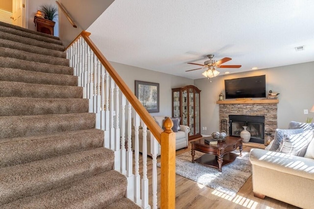 1699 Burnt Oak Dr Unit 195, Dalton, GA 30721 - living area featuring wood finished floors, stairs, ceiling fan, a stone fireplace, and recessed lighting