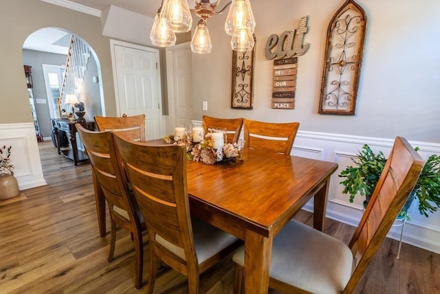 1699 Burnt Oak Dr Unit 195, Dalton, GA 30721 - dining area with arched walkways, wood finished floors, a wainscoted wall, a chandelier, and a decorative wall