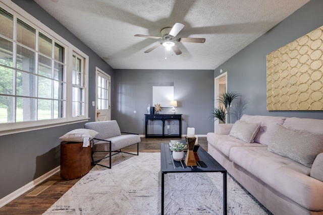 1529 W Grab Creek Rd, Dickson, TN 37055 - living area featuring wood finished floors, a ceiling fan, and a textured ceiling