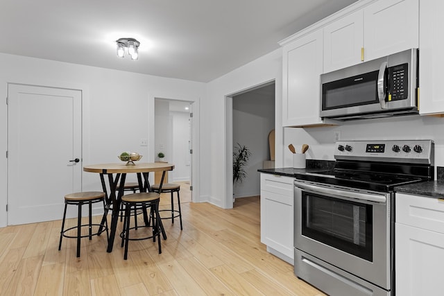 109 Anderson Dr, Chattanooga, TN 37421 - kitchen with appliances with stainless steel finishes, white cabinets, and light wood-style flooring