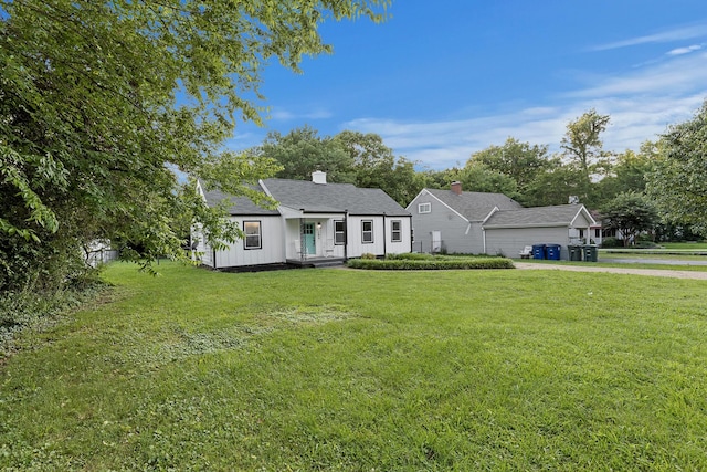 109 Anderson Dr, Chattanooga, TN 37421 - view of front of house with board and batten siding, a front lawn, a shingled roof, and a chimney