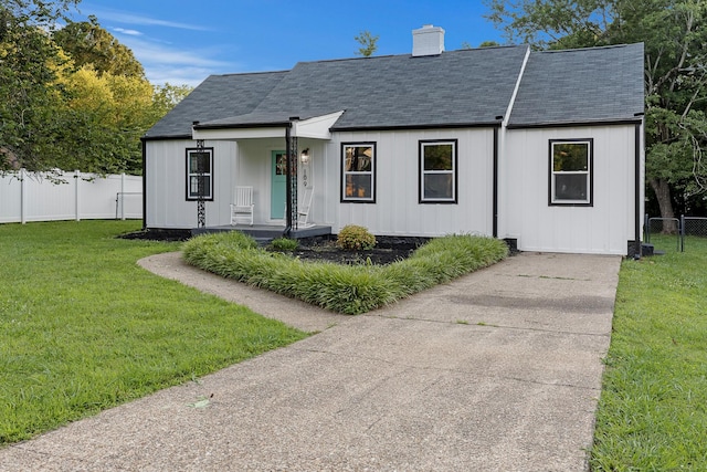 109 Anderson Dr, Chattanooga, TN 37421 - view of front of house with roof with shingles, a chimney, and covered porch
