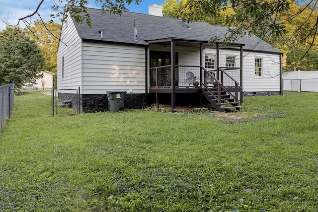 109 Anderson Dr, Chattanooga, TN 37421 - back of property with a fenced backyard, a shingled roof, a chimney, and a wooden deck