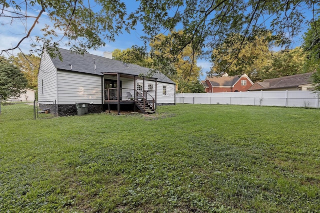 109 Anderson Dr, Chattanooga, TN 37421 - rear view of property with a fenced backyard, a wooden deck, stairway, a chimney, and a shingled roof