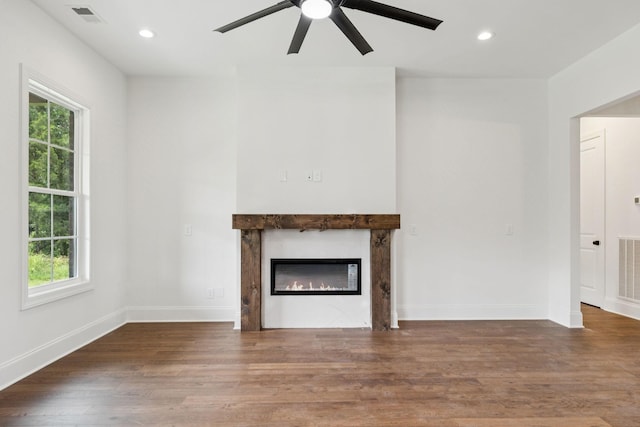 508 Matthew Miller Dr, Smyrna, TN 37167 - unfurnished living room with ceiling fan, healthy amount of natural light, wood finished floors, a glass covered fireplace, and recessed lighting